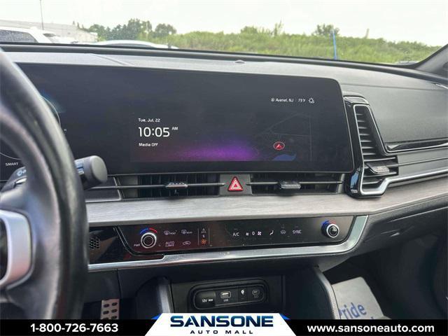 Photo of 2023 Jungle Green/Ebony Black Roof Kia Sportage