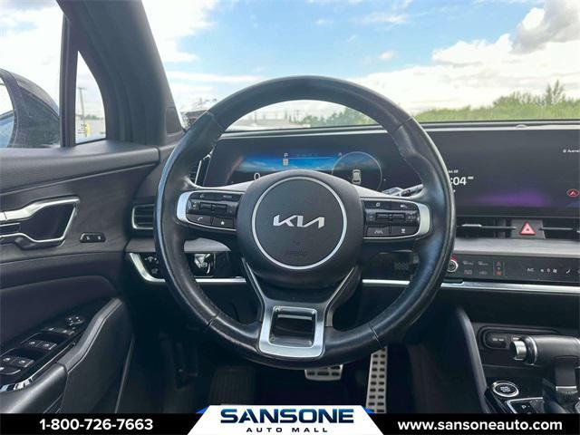 Photo of 2023 Jungle Green/Ebony Black Roof Kia Sportage