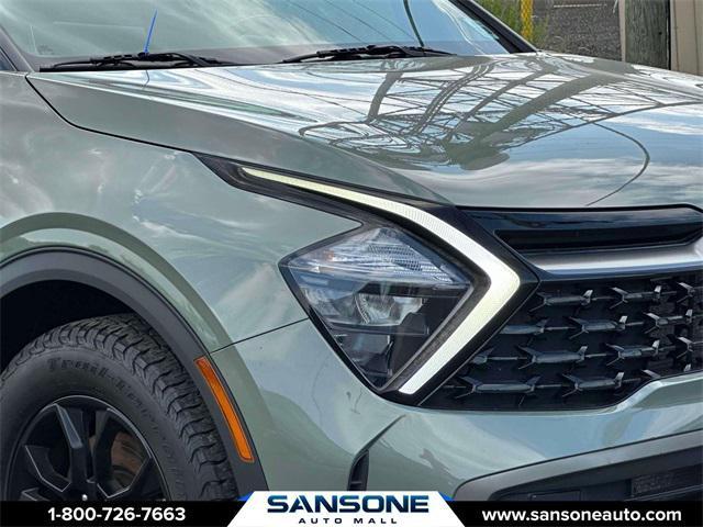 Photo of 2023 Jungle Green/Ebony Black Roof Kia Sportage