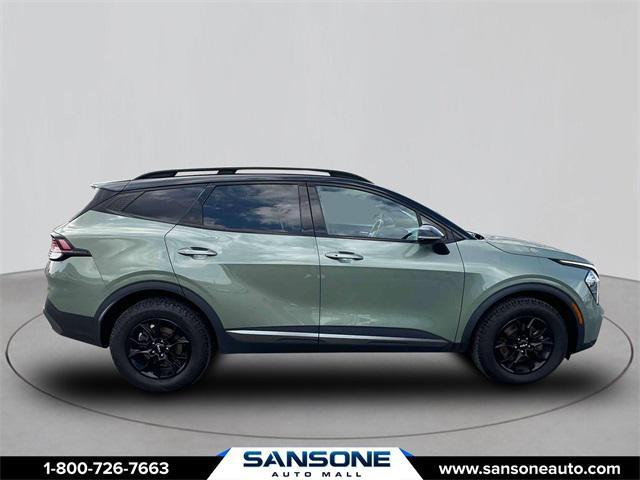 Photo of 2023 Jungle Green/Ebony Black Roof Kia Sportage