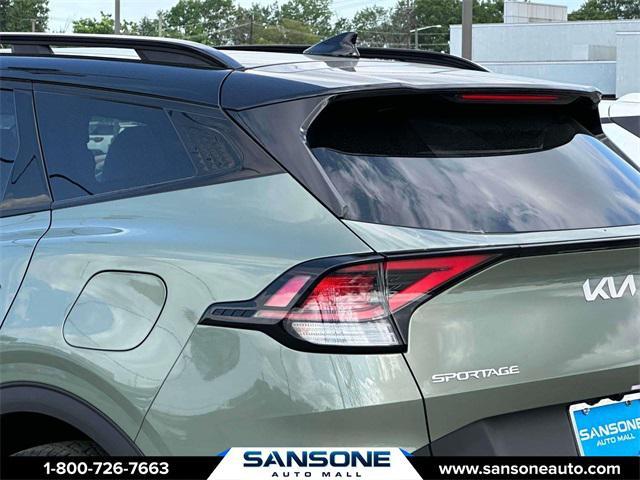 Photo of 2023 Jungle Green/Ebony Black Roof Kia Sportage