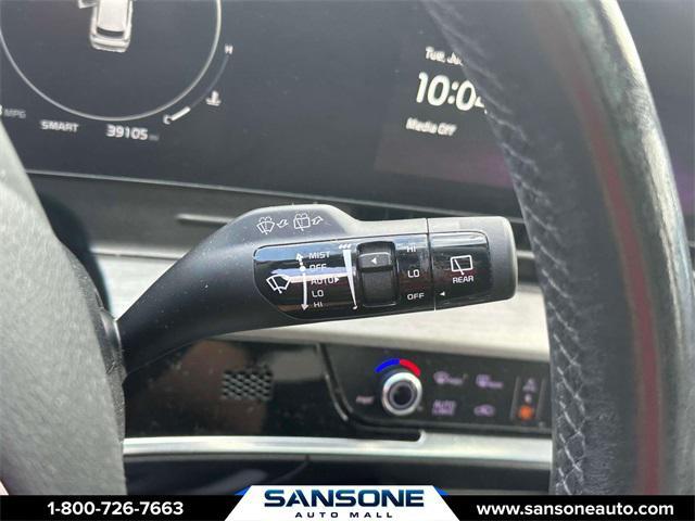 Photo of 2023 Jungle Green/Ebony Black Roof Kia Sportage