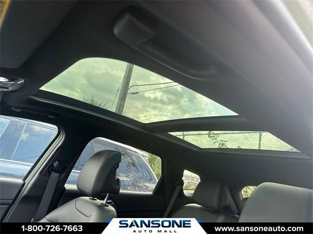 Photo of 2023 Jungle Green/Ebony Black Roof Kia Sportage