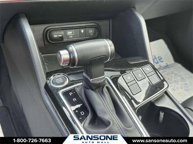 Photo of 2023 Jungle Green/Ebony Black Roof Kia Sportage