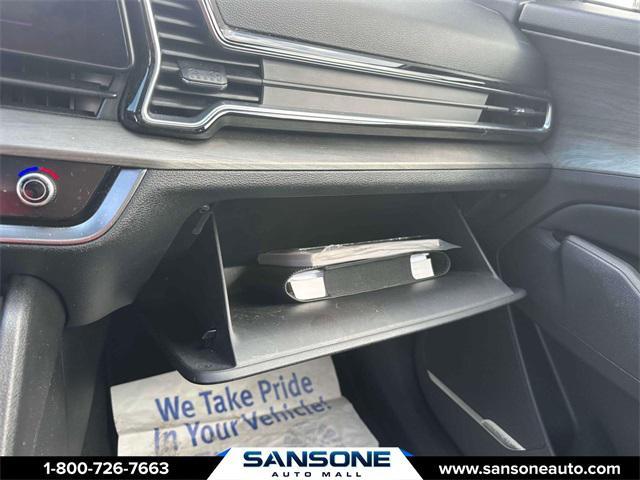 Photo of 2023 Jungle Green/Ebony Black Roof Kia Sportage