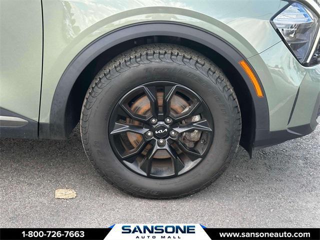 Photo of 2023 Jungle Green/Ebony Black Roof Kia Sportage