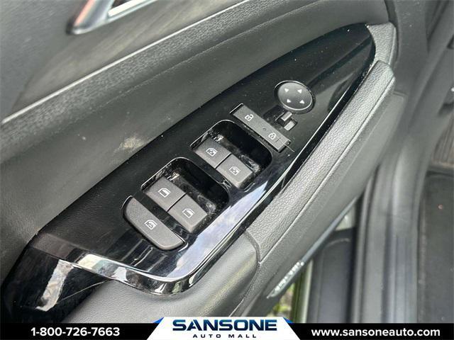 Photo of 2023 Jungle Green/Ebony Black Roof Kia Sportage