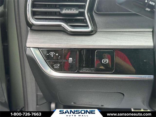Photo of 2023 Jungle Green/Ebony Black Roof Kia Sportage
