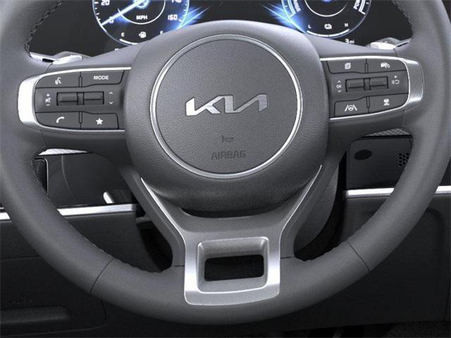 Photo of 2025 White Pearl Kia Sportage Hybrid