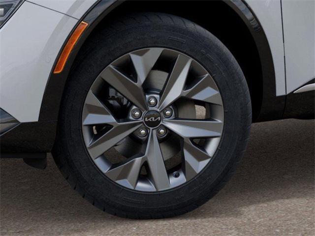 Photo of 2025 White Pearl Kia Sportage Hybrid