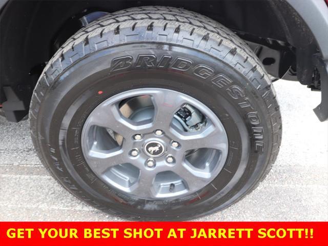 Photo of 2025 Ruby Red Metallic Tinted Clearcoat Ford Bronco