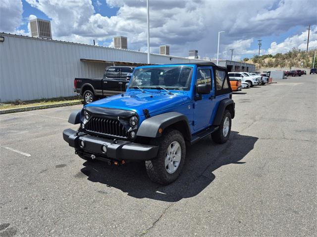 Photo of 2015 Hydro Blue Pearl Coat Jeep Wrangler