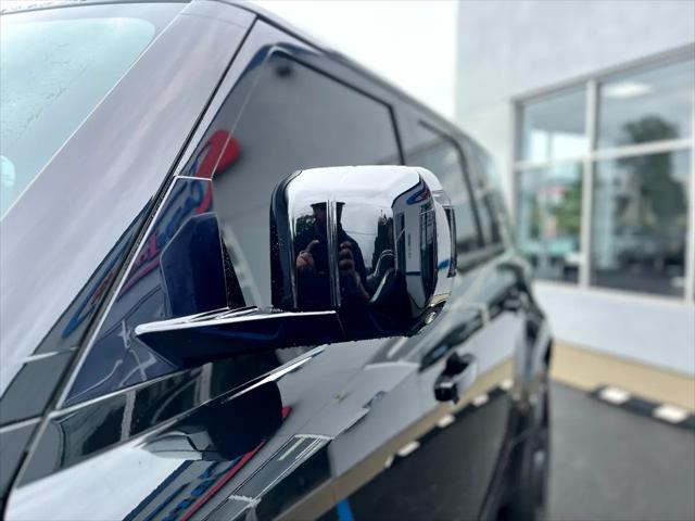 Photo of 2023 Santorini Black Metallic Land Rover Defender