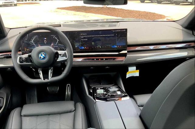 Photo of 2026 Oxide Grey Metallic BMW 550e