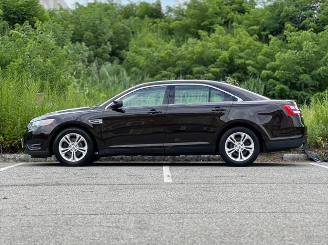 Photo of 2013 Kodiak Brown Metallic Ford Taurus