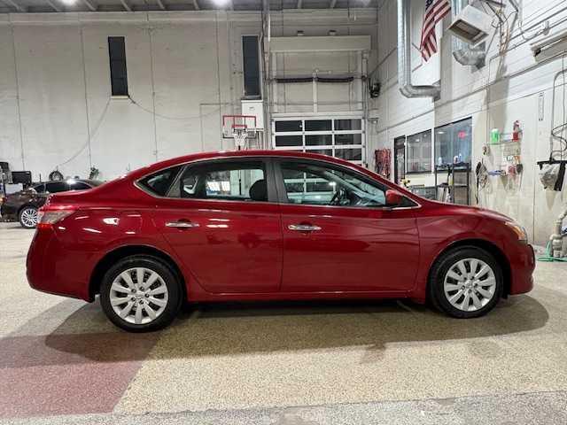 Photo of 2013 Red Brick Nissan Sentra