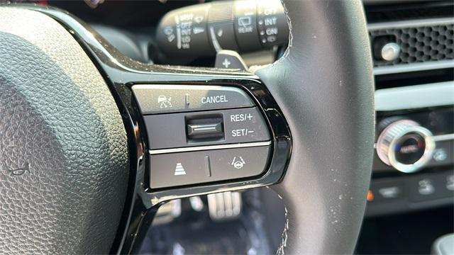 Photo of 2025 Boost Blue Pearl Honda Civic Hybrid
