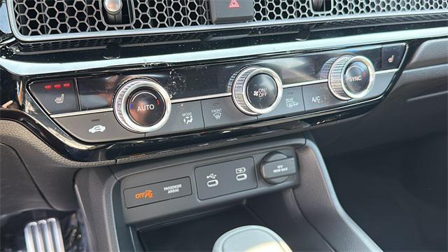 Photo of 2025 Boost Blue Pearl Honda Civic Hybrid