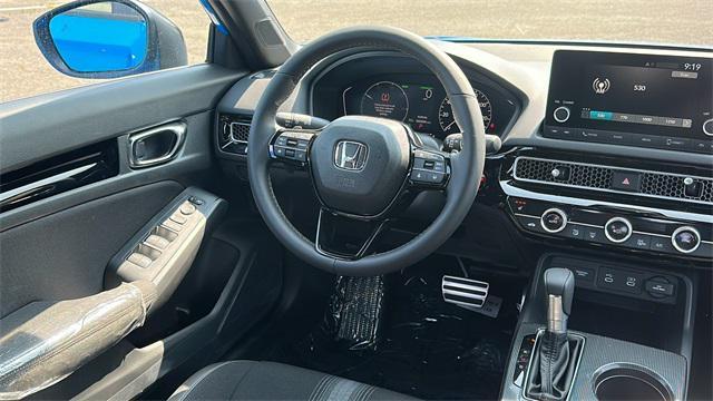 Photo of 2025 Boost Blue Pearl Honda Civic Hybrid