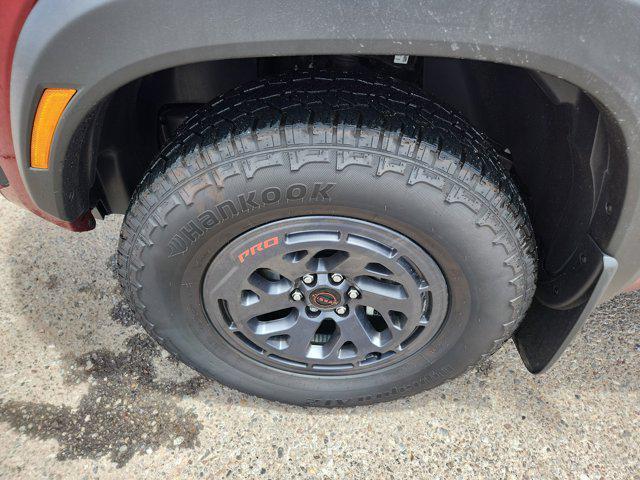 Photo of 2025 Cardinal Red Metallic Tricoat Nissan Frontier