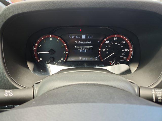 Photo of 2025 Cardinal Red Metallic Tricoat Nissan Frontier