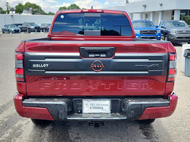 Photo of 2025 Cardinal Red Metallic Tricoat Nissan Frontier