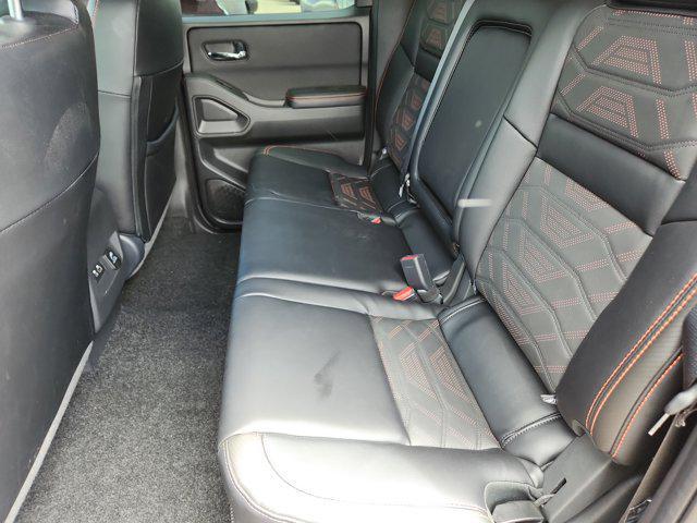Photo of 2025 Cardinal Red Metallic Tricoat Nissan Frontier