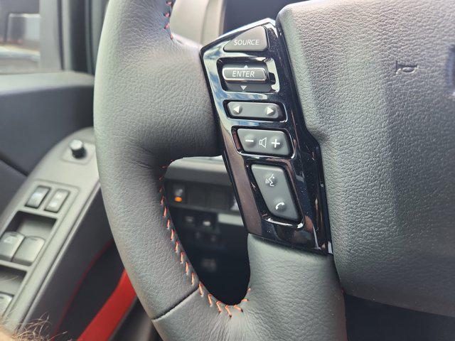 Photo of 2025 Cardinal Red Metallic Tricoat Nissan Frontier