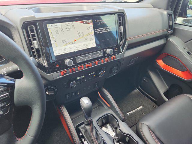 Photo of 2025 Cardinal Red Metallic Tricoat Nissan Frontier