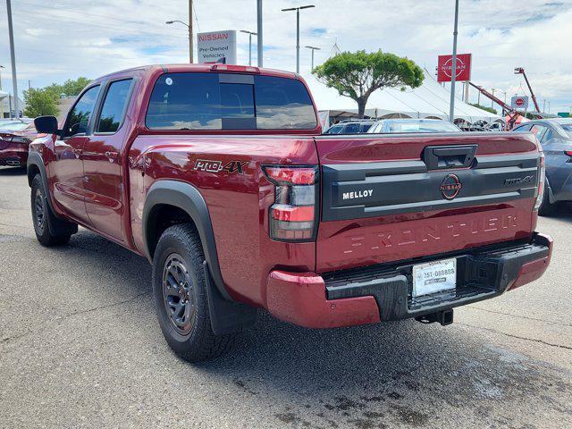 Photo of 2025 Cardinal Red Metallic Tricoat Nissan Frontier