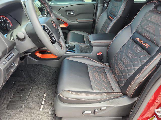 Photo of 2025 Cardinal Red Metallic Tricoat Nissan Frontier