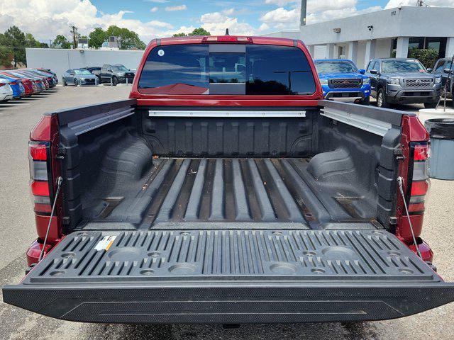 Photo of 2025 Cardinal Red Metallic Tricoat Nissan Frontier