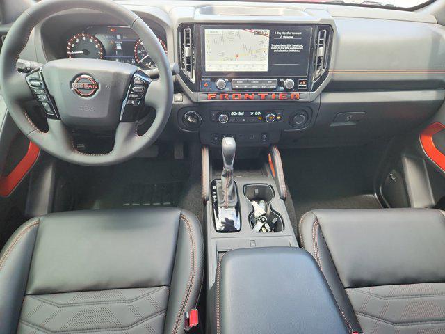 Photo of 2025 Cardinal Red Metallic Tricoat Nissan Frontier