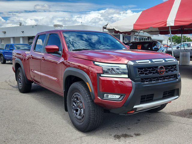 Photo of 2025 Cardinal Red Metallic Tricoat Nissan Frontier