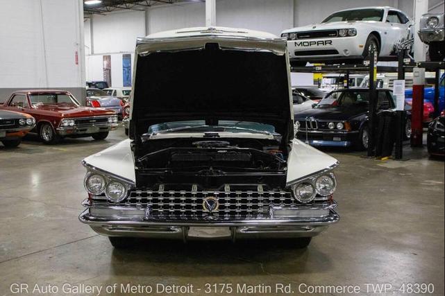 Photo of 1959 Artic White and Tampico Red Buick LeSabre
