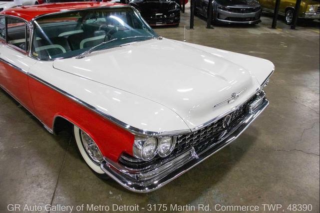 Photo of 1959 Artic White and Tampico Red Buick LeSabre