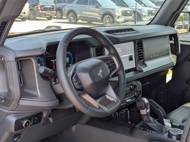 Photo of 2025 Ruby Red Metallic Tinted Clearcoat Ford Bronco