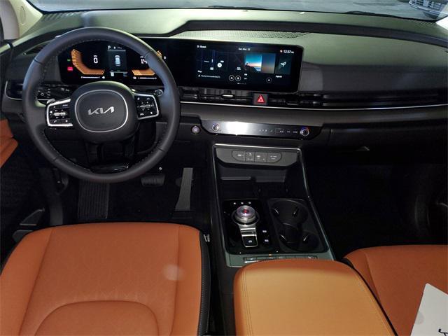 Photo of 2025 Aurora Black Pearl Kia Carnival Hybrid