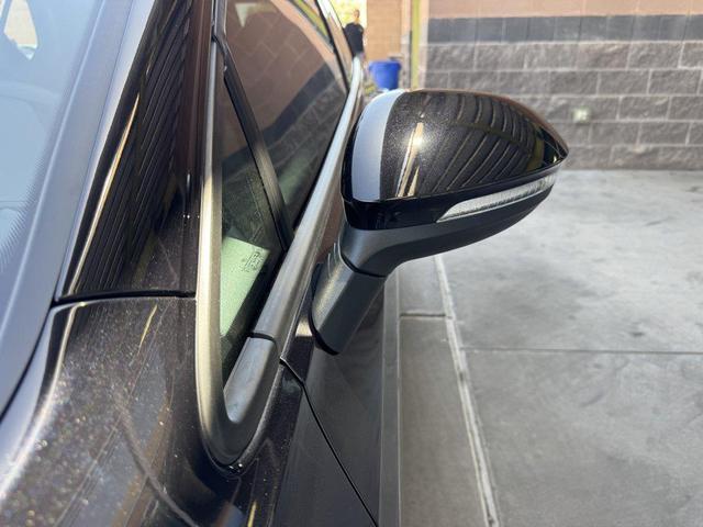 Photo of 2024 Deep Black Pearl Volkswagen Golf GTI