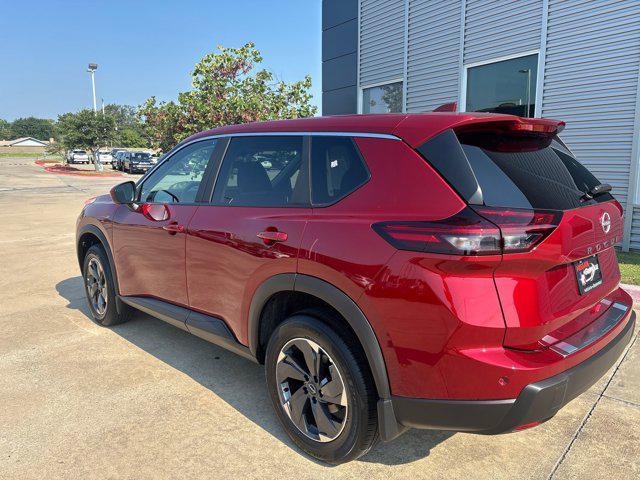 Photo of 2026 Scarlet Ember Tintcoat Nissan Rogue