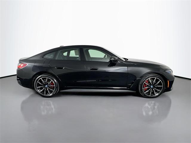 Photo of 2024 Black Sapphire Metallic BMW i4 Gran Coupe