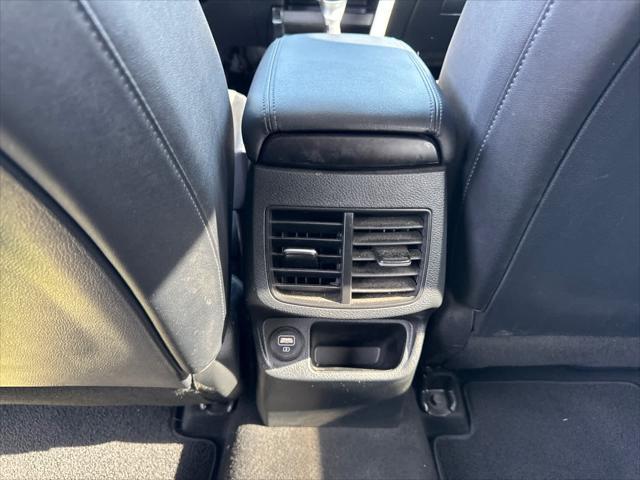 Photo of 2023 Starbright Yellow/Black Roof Kia Seltos