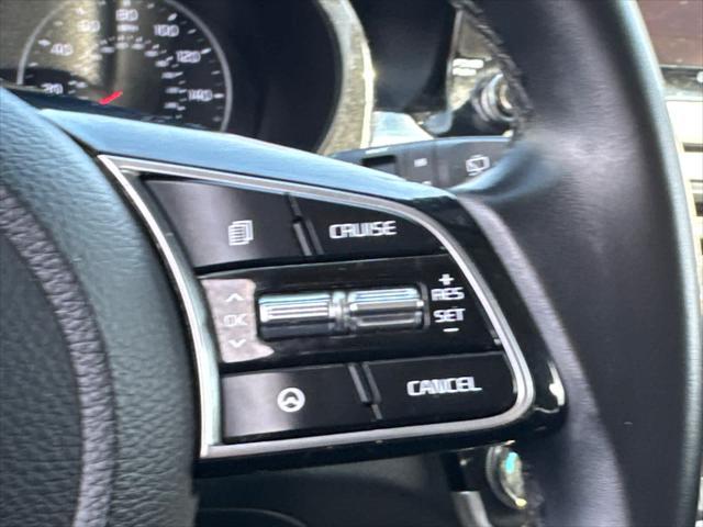 Photo of 2023 Starbright Yellow/Black Roof Kia Seltos