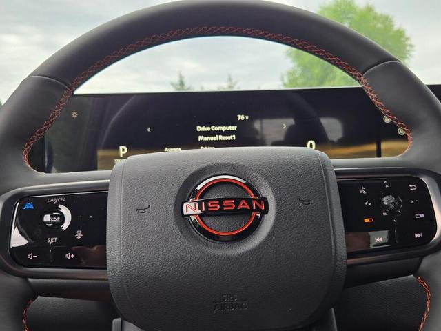 Photo of 2025 Aspen White Tricoat/Super Black Nissan Armada
