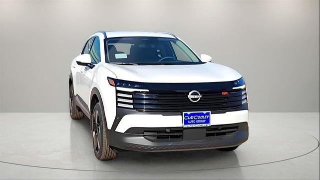 Photo of 2025 Aspen White Tricoat Nissan Kicks