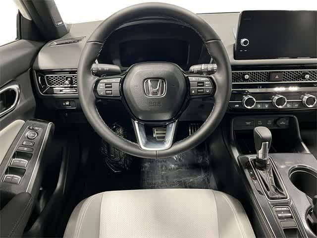 Photo of 2026 Boost Blue Pearl Honda Civic Hybrid