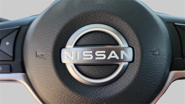 Photo of 2025 Scarlet Ember Tintcoat Nissan Versa