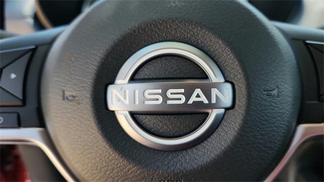 Photo of 2025 Scarlet Ember Tintcoat Nissan Versa