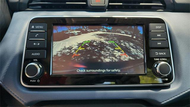 Photo of 2025 Scarlet Ember Tintcoat Nissan Versa