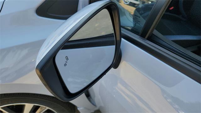Photo of 2025 Aspen White Tricoat Nissan Versa